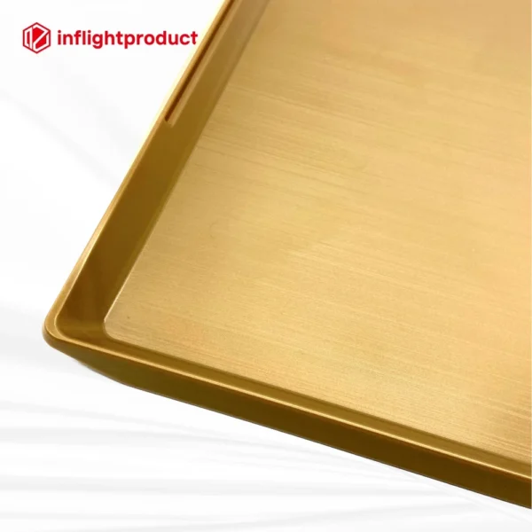 Lightweight plastic airline meal tray with refined brushed surface