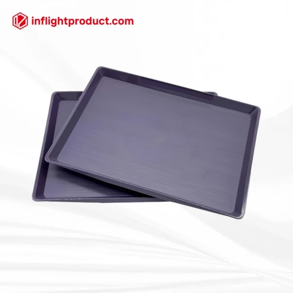 Airline meal tray with brushed surface for stylish onboard presentation