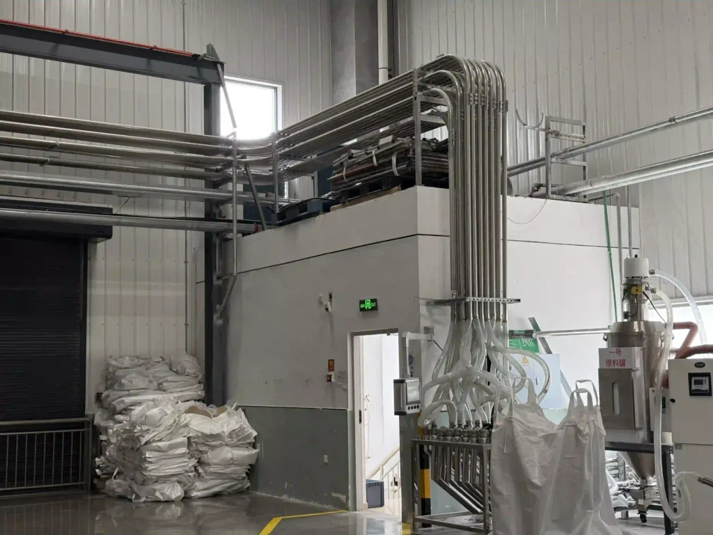 Central material conveying system of disposable cutlery production line
