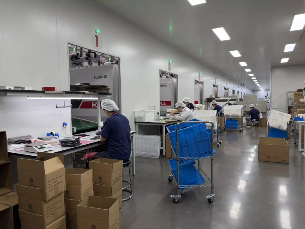 Manual packaging workstation at Shanghai Yiting Disposable Cutlery Production line